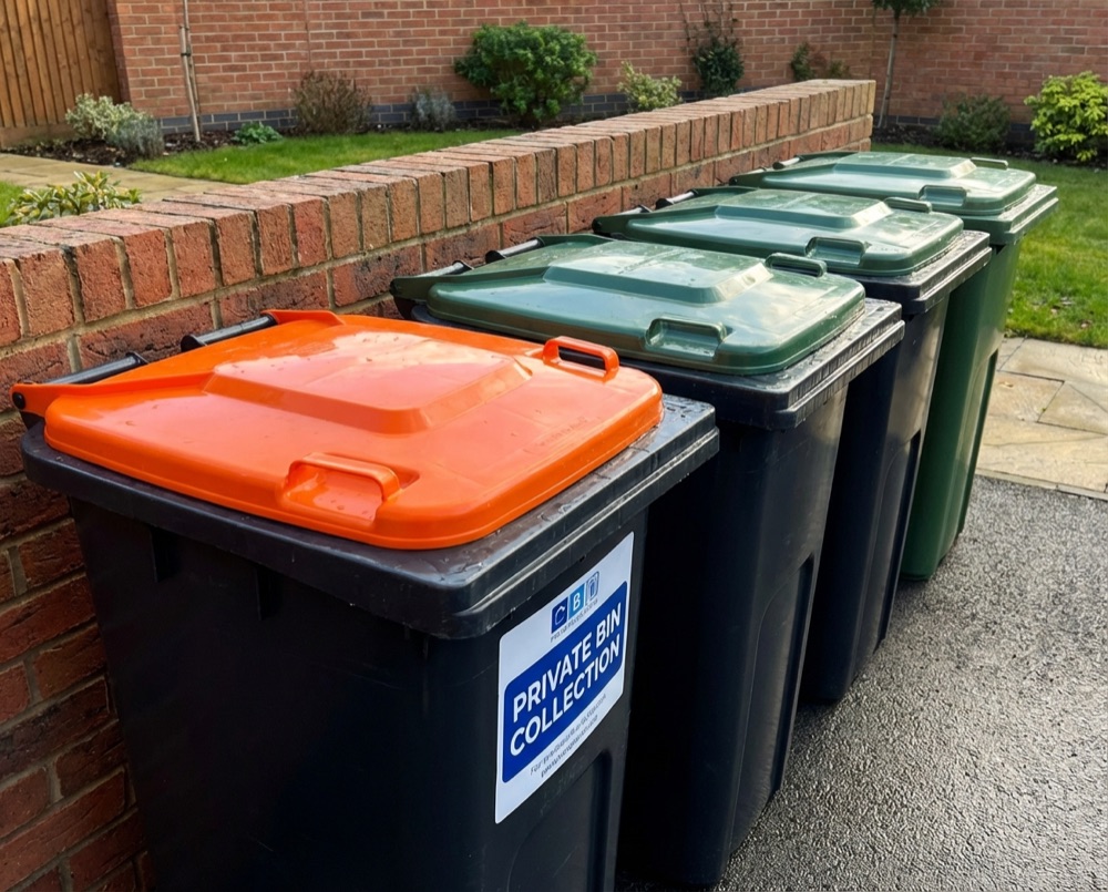 Recycling and general waste bins on a Rustington street